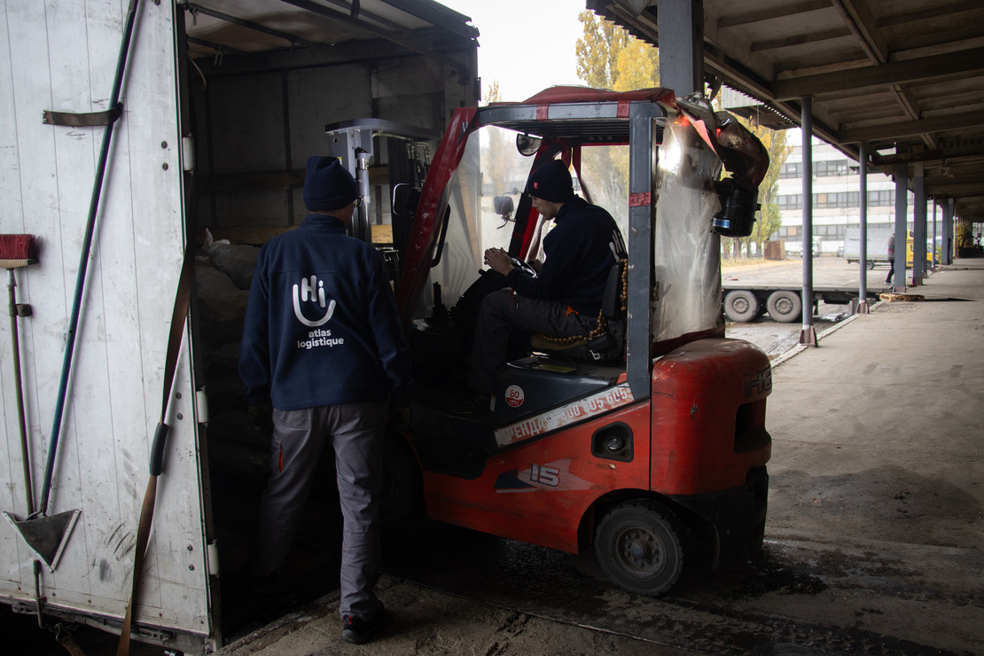 Atlas Logistique agents load solid fuel briquettes into a truck in November 2024 in Dnipro, eastern Ukraine. 